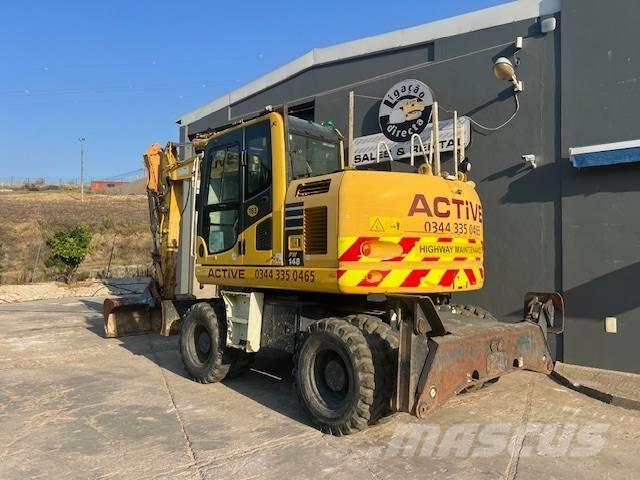 Komatsu PW 148 Lastik tekerli ekskavatörler