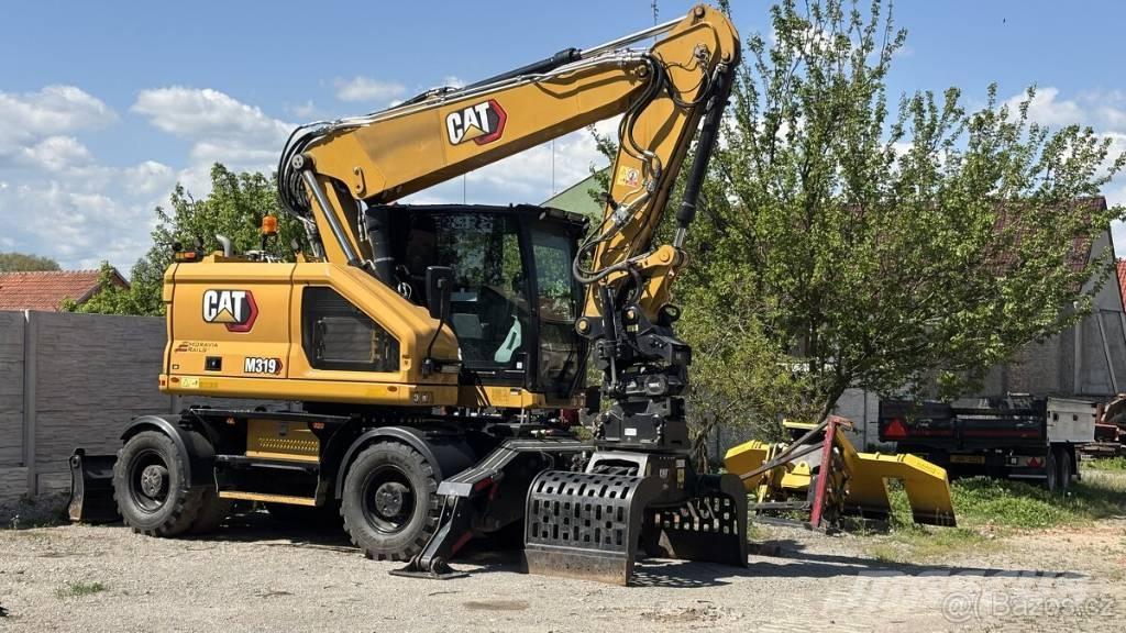 CAT M 319 Lastik tekerli ekskavatörler