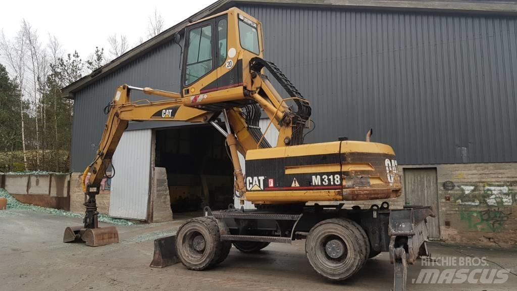 CAT M 318 Atık taşıma araçları