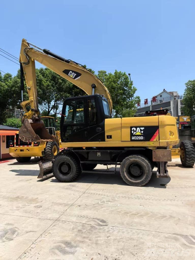 CAT M 320 Lastik tekerli ekskavatörler