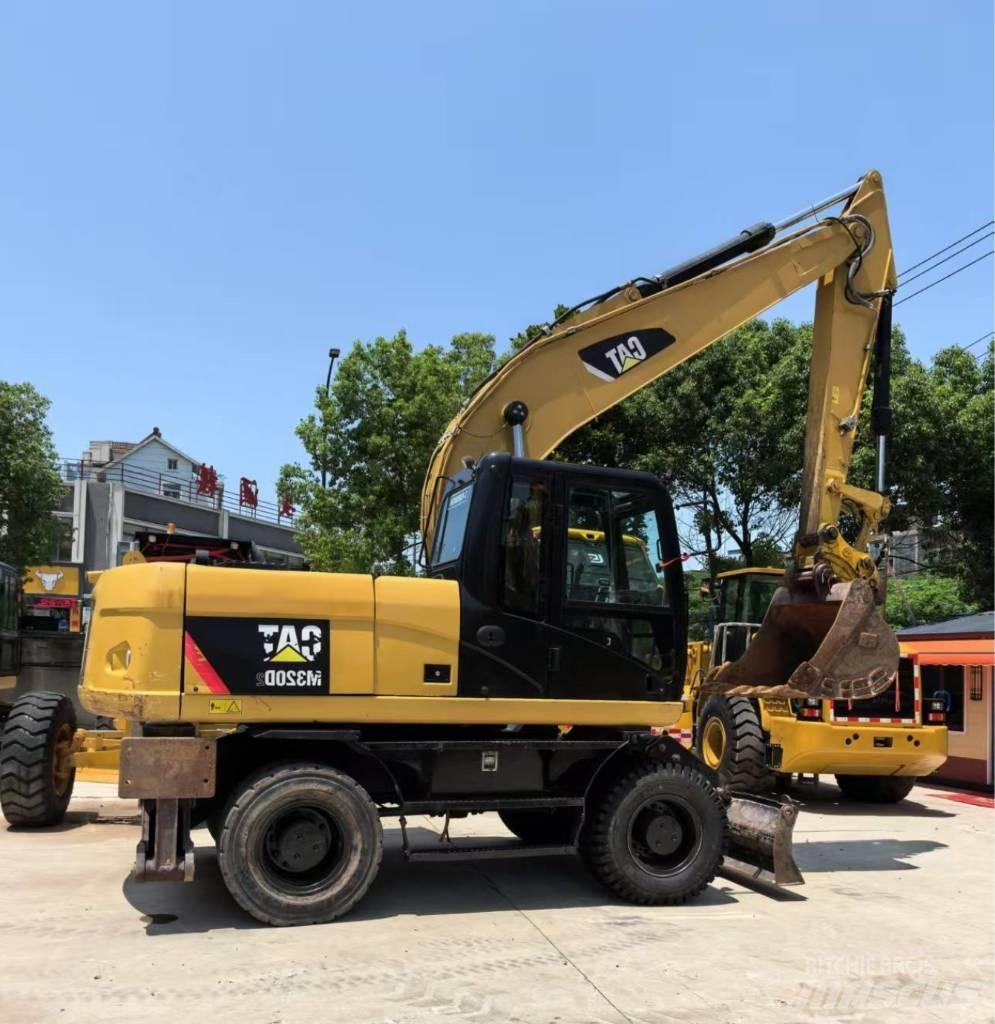 CAT M 320 Lastik tekerli ekskavatörler