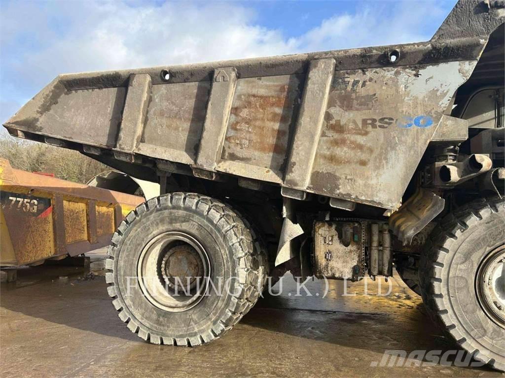 CAT 775G Belden kirma kaya kamyonu