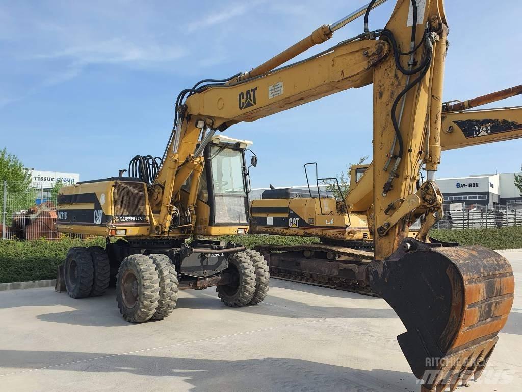 CAT M 318 Lastik tekerli ekskavatörler