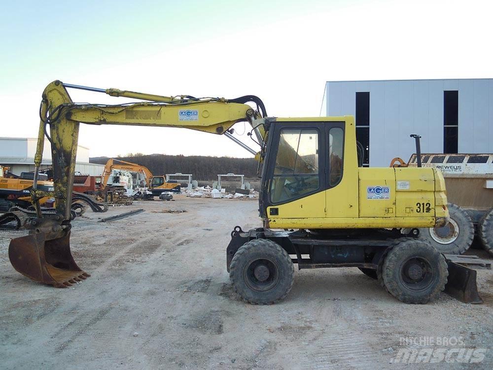 CAT M312 Lastik tekerli ekskavatörler