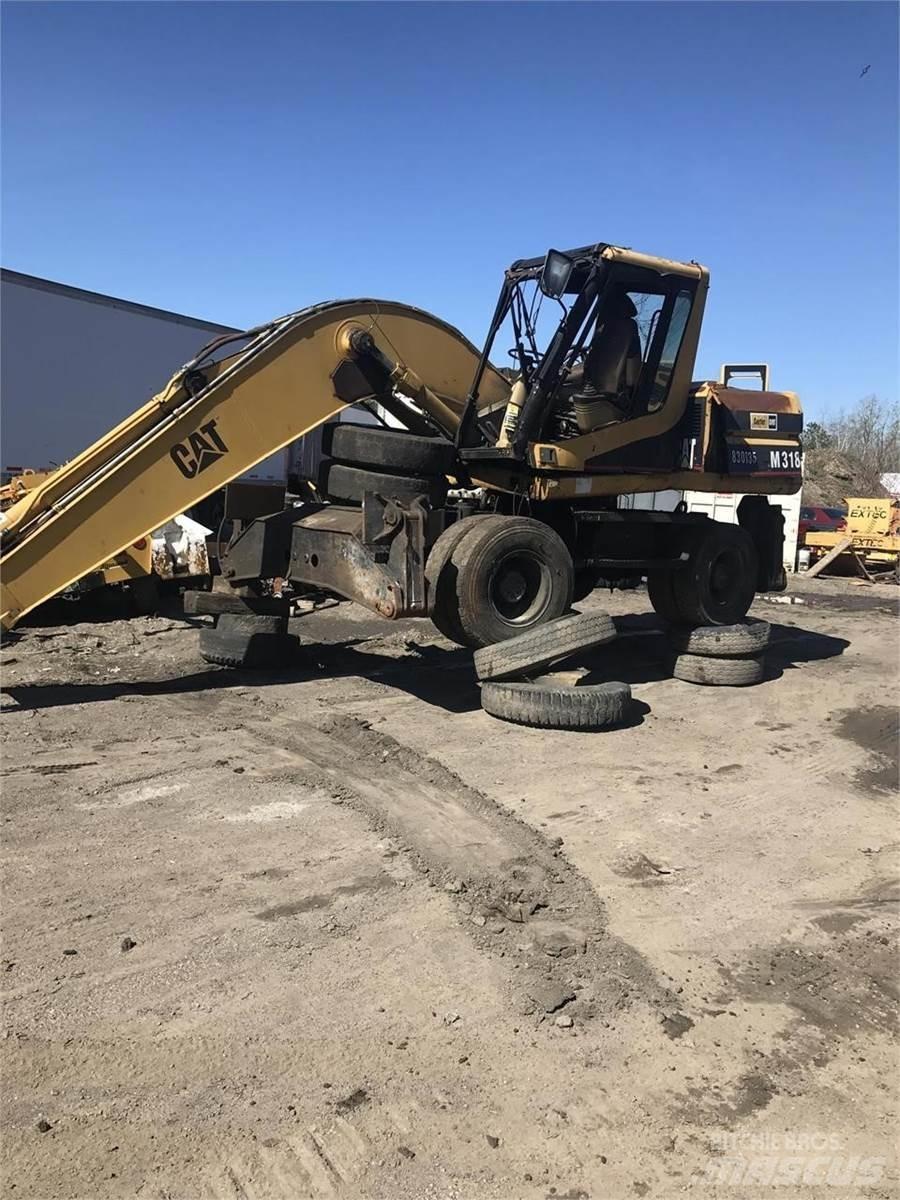 CAT M318 Lastik tekerli ekskavatörler