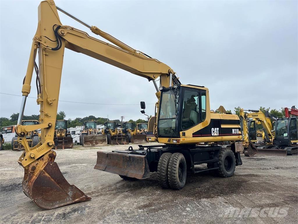 CAT M318 Lastik tekerli ekskavatörler