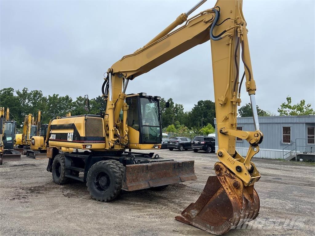 CAT M318 Lastik tekerli ekskavatörler