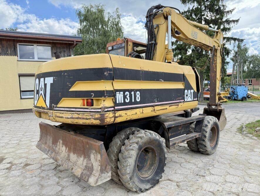 CAT M318 Lastik tekerli ekskavatörler