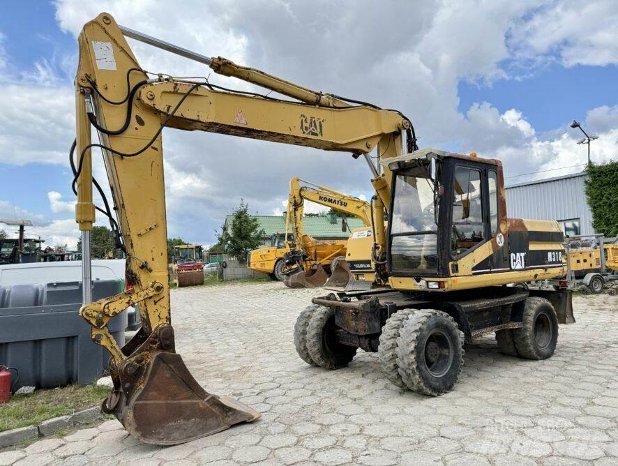 CAT M318 Lastik tekerli ekskavatörler